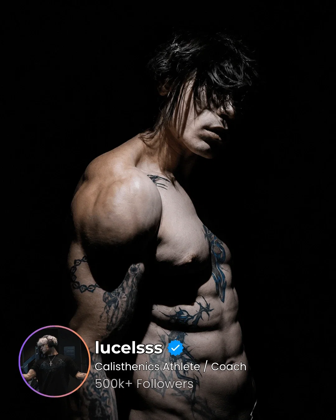Lean tattooed athlete against black, abdominals and obliques modelled by a single hard key light