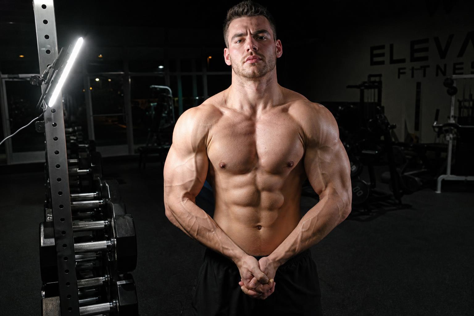 AI-generated illustration: the same scene re-rendered as if lit from the front at about 45 degrees, with deeper shadow under the chest and abdominals. Not a photograph